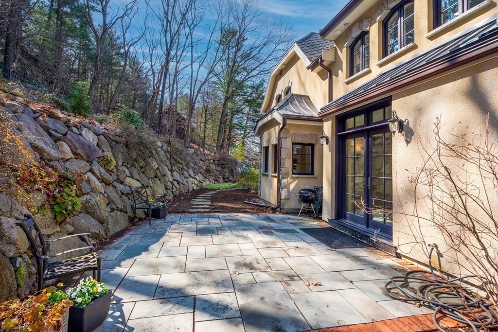 7 Wolcott Road Winchester, MA 01890 - Photo 32 of 41 a view of a pathway with a house