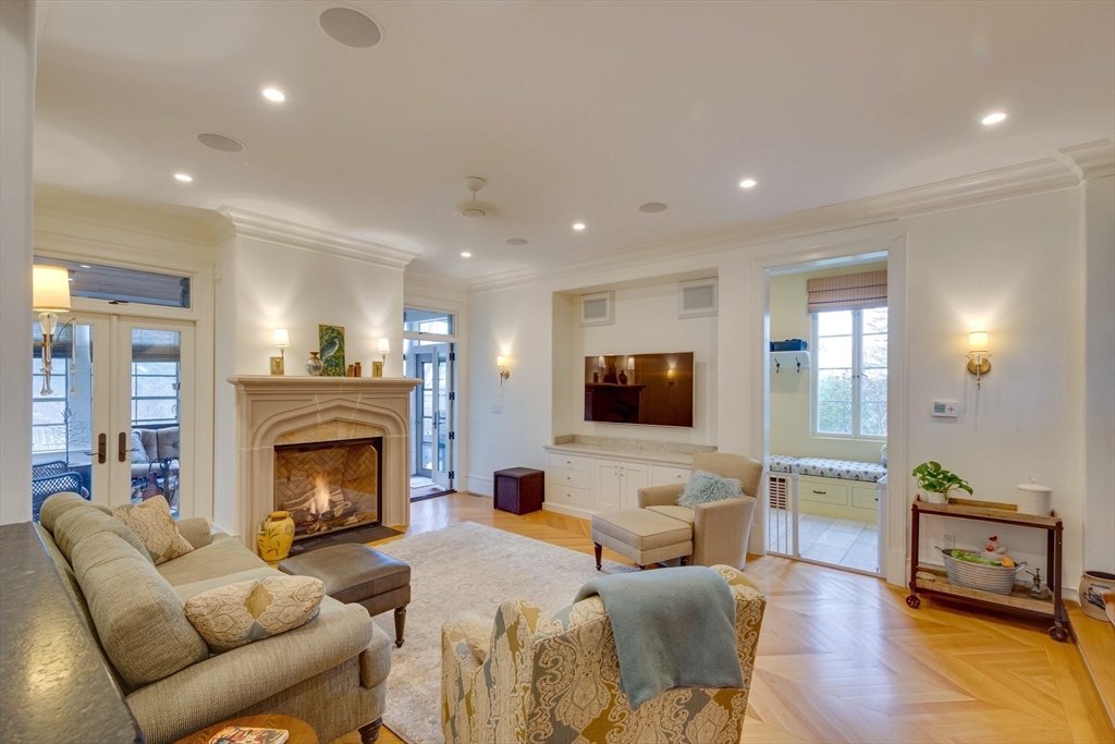 7 Wolcott Road Winchester, MA 01890 - Photo 7 of 41 a living room with furniture a fireplace and a flat screen tv