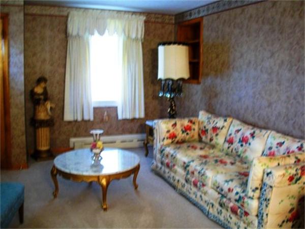 14 Dunbar Street Springfield, MA 01118 - Photo 3 of 26 a living room with a couch and a table
