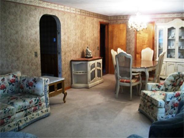 14 Dunbar Street Springfield, MA 01118 - Photo 4 of 26 a living room with furniture and a fireplace