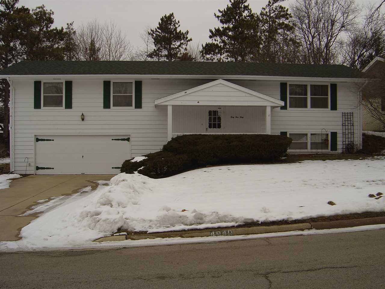 4940 Welsh Road Rockford, IL 61107 - Photo 1 of 12 a front view of a house with a yard