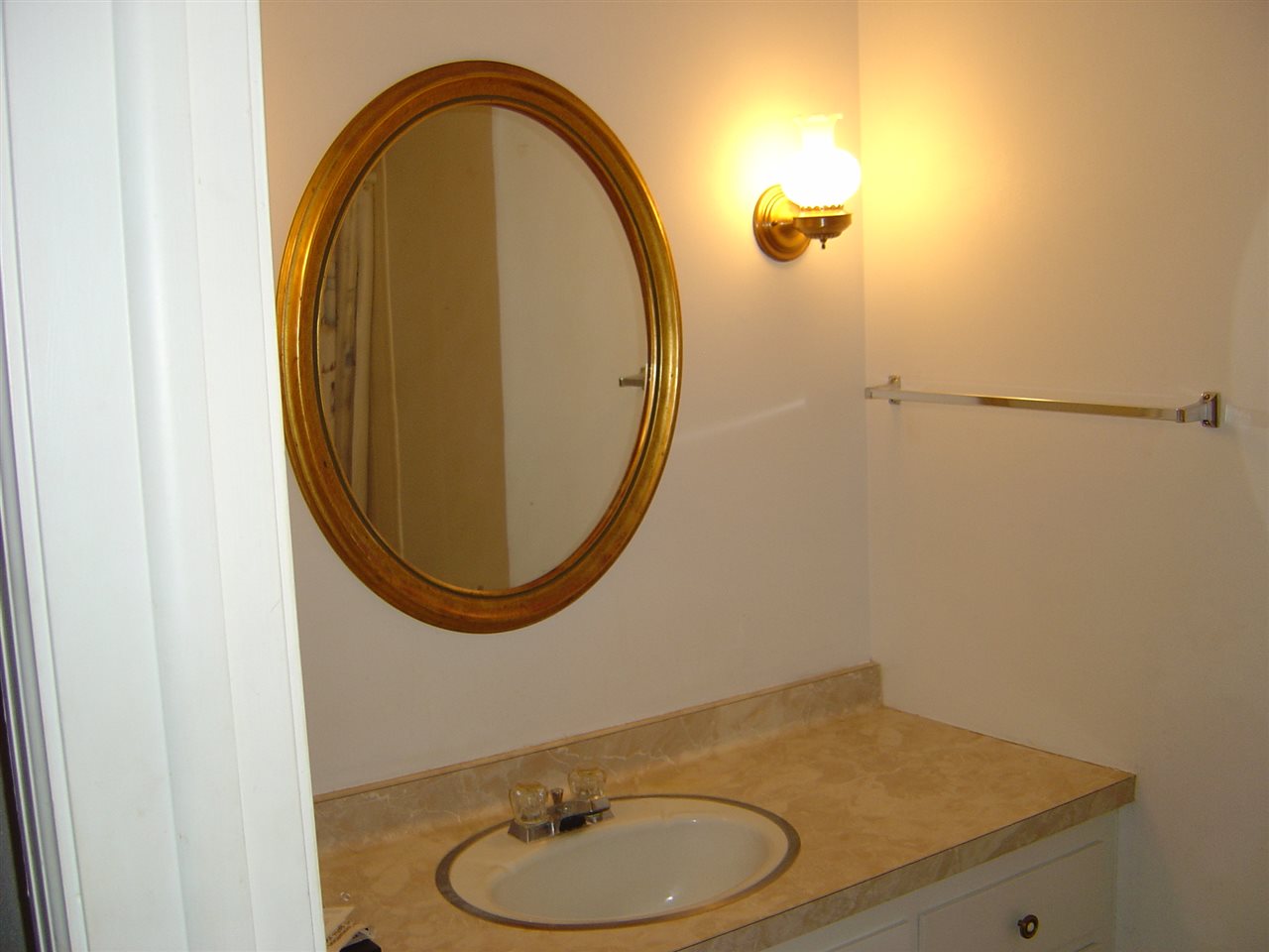 4940 Welsh Road Rockford, IL 61107 - Photo 7 of 12 a bathroom with a sink and a mirror