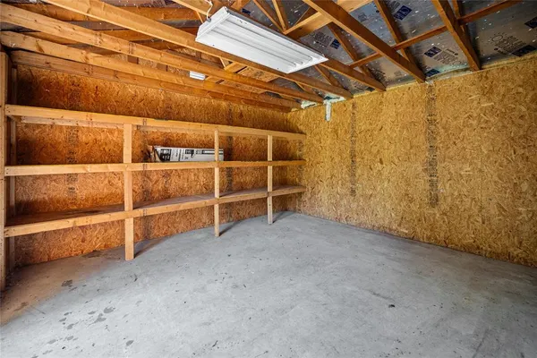 a view of an empty room with empty shelves
