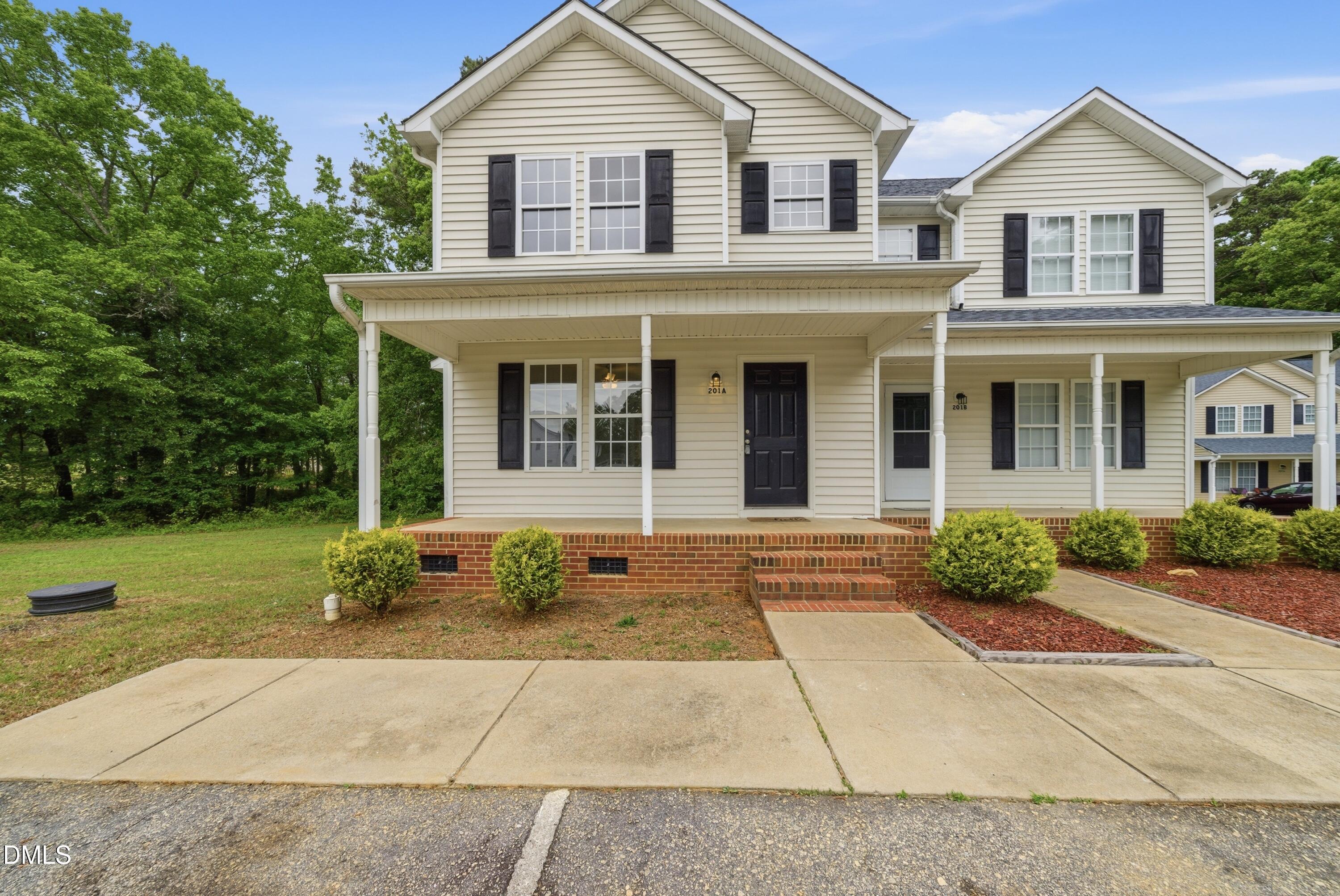 201 Tonylee Court, Unit A Raleigh, NC 27603 - Photo 2 of 30 a front view of a house with garden