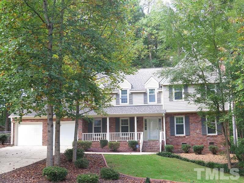 1317 Ravenhurst Drive Raleigh, NC 27615 - Photo 2 of 23 a front view of a house with a yard and potted plants