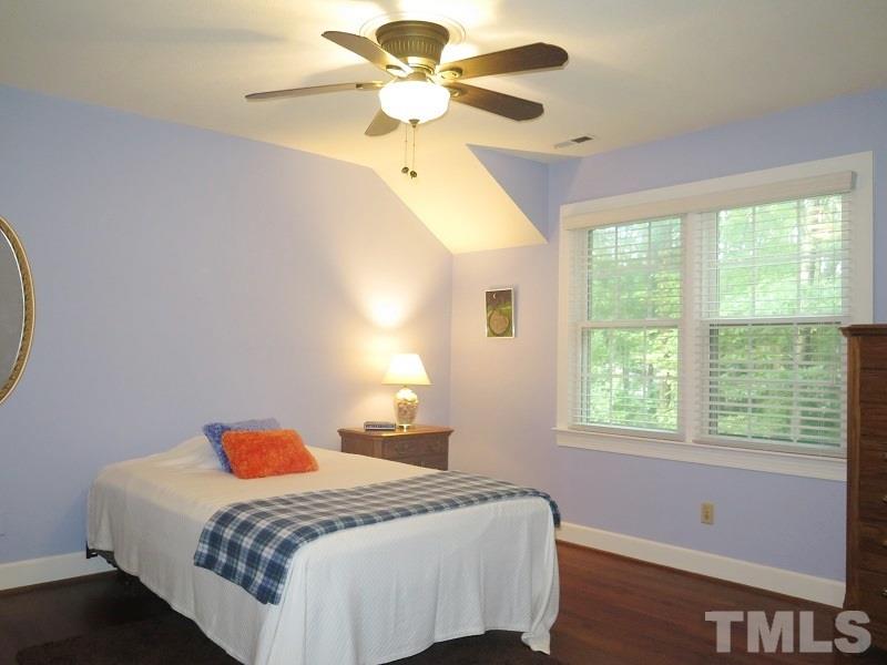 1317 Ravenhurst Drive Raleigh, NC 27615 - Photo 13 of 23 a bedroom with a bed and a window