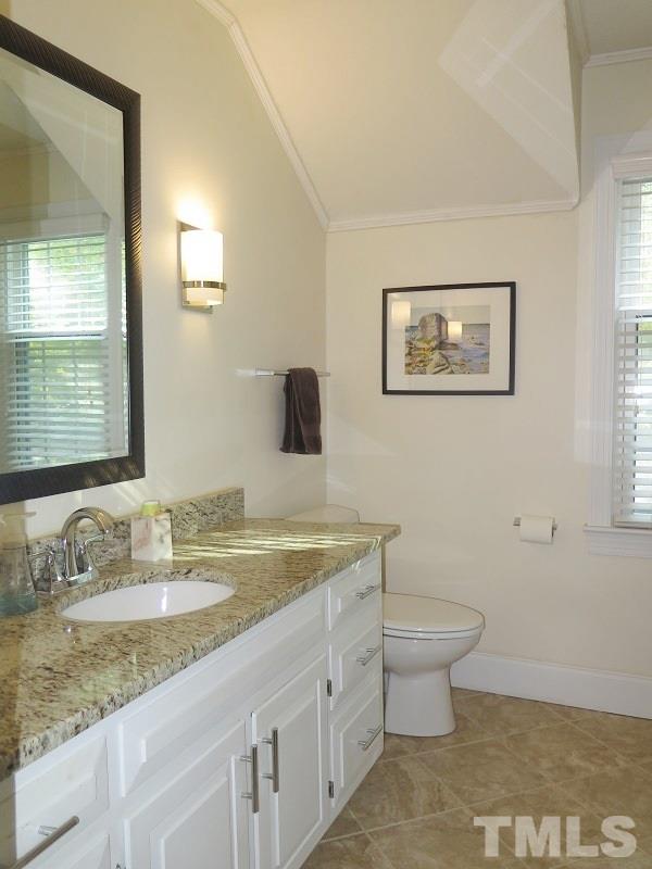 1317 Ravenhurst Drive Raleigh, NC 27615 - Photo 15 of 23 a bathroom with a granite countertop sink and a mirror