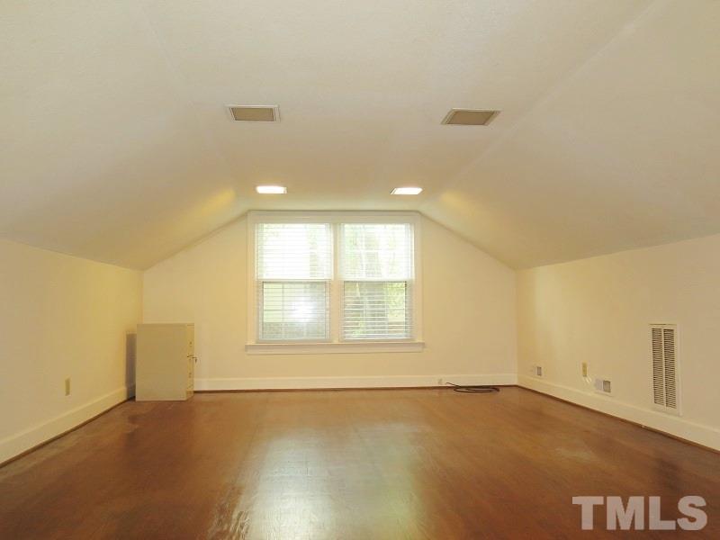 1317 Ravenhurst Drive Raleigh, NC 27615 - Photo 17 of 23 an empty room with a empty space and windows