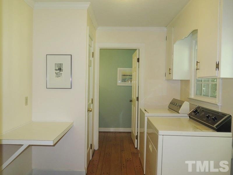 1317 Ravenhurst Drive Raleigh, NC 27615 - Photo 18 of 23 a room that has a sink and a bed in it