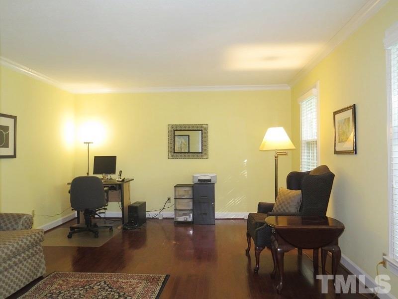 1317 Ravenhurst Drive Raleigh, NC 27615 - Photo 3 of 23 a living room with furniture and a lamp