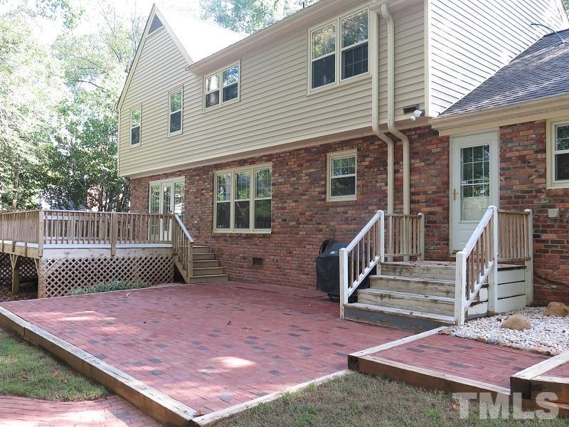 1317 Ravenhurst Drive Raleigh, NC 27615 - Photo 23 of 23 a front view of a house with a garden