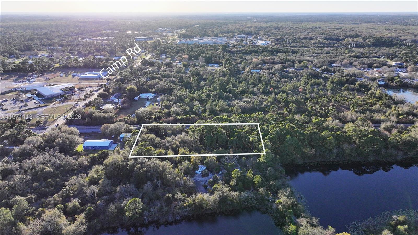 Not Assigned Cocoa, FL 32922 - Photo 3 of 6 an aerial view of house with yard and mountain view in back