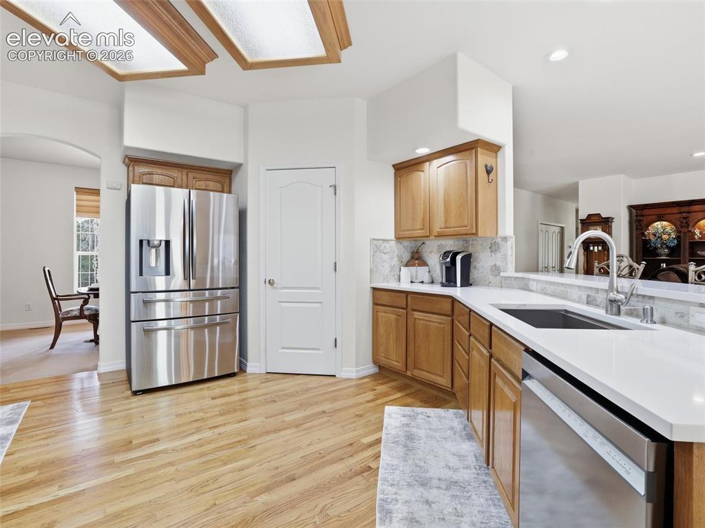 12855 Murphy Road Elbert, CO 80106 - Photo 8 of 50 a kitchen with stainless steel appliances granite countertop a refrigerator and a sink