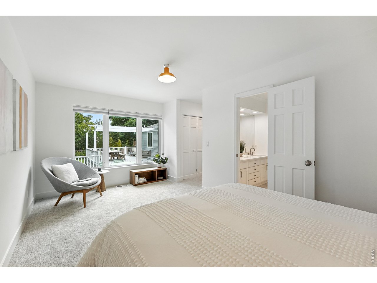 4557 Apple Way Boulder, CO 80301 - Photo 24 of 42 Main level guest suite boasts en-suite bath, spacious closet and large windows peering over the beautiful and mature backyard.