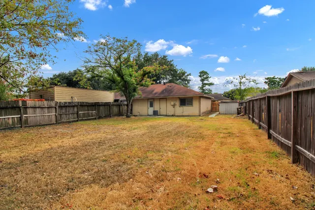 a backyard of a house with lots of green space