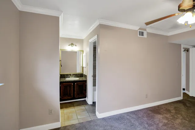 a view of a hallway and an empty room