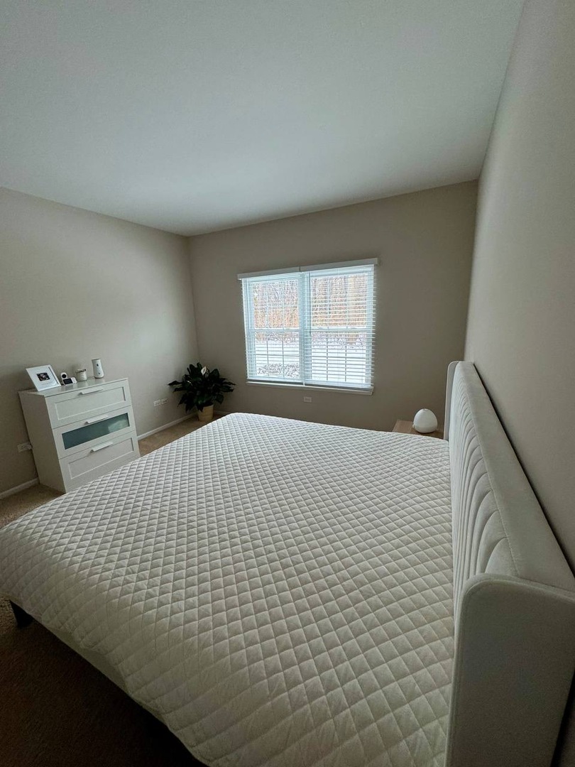 5261 Pebble Lane Crystal Lake, IL 60012 - Photo 14 of 21 a bedroom with a bed and window
