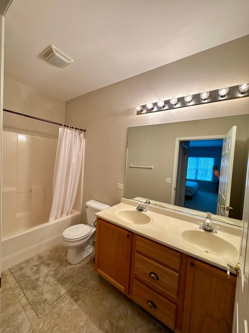 5261 Pebble Lane Crystal Lake, IL 60012 - Photo 17 of 21 a bathroom with a double vanity sink mirror and toilet