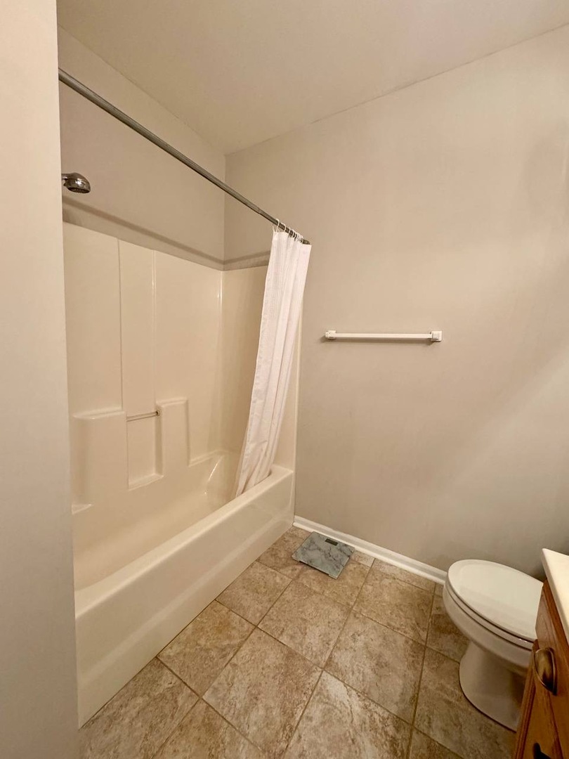 5261 Pebble Lane Crystal Lake, IL 60012 - Photo 19 of 21 a bathroom with a toilet and a shower