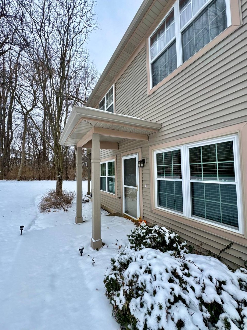 5261 Pebble Lane Crystal Lake, IL 60012 - Photo 3 of 21 a front view of a house with a yard