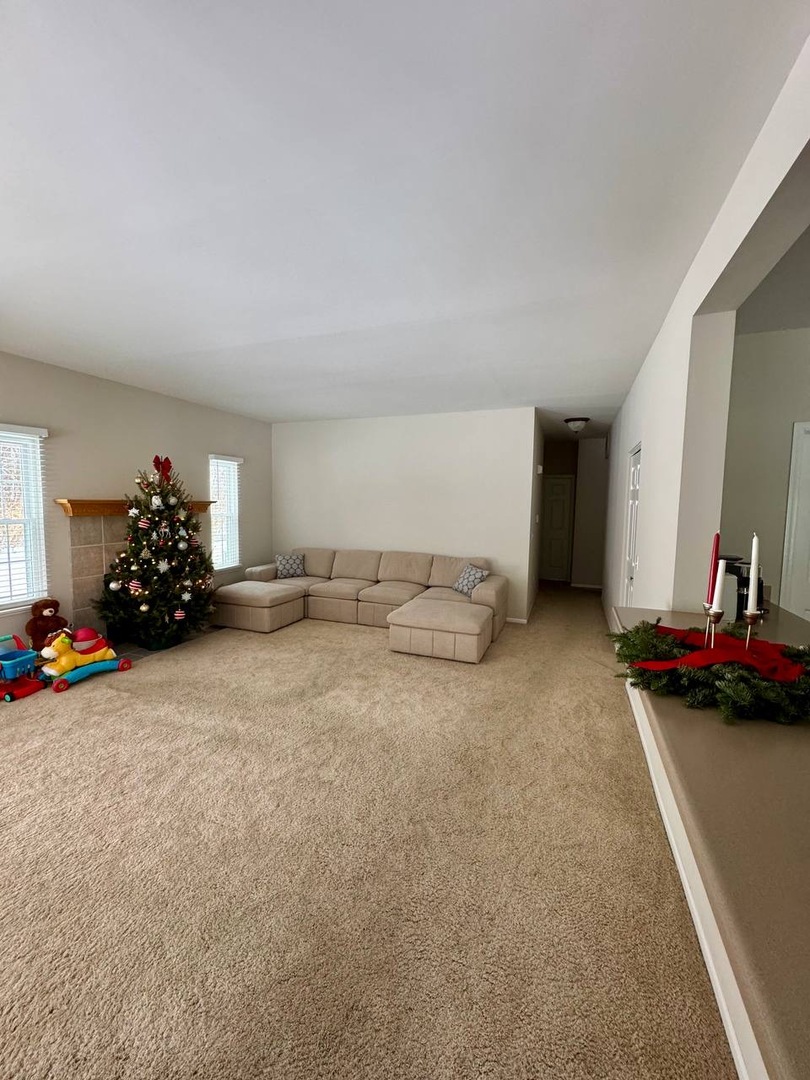 5261 Pebble Lane Crystal Lake, IL 60012 - Photo 7 of 21 a room with a bed and a couch