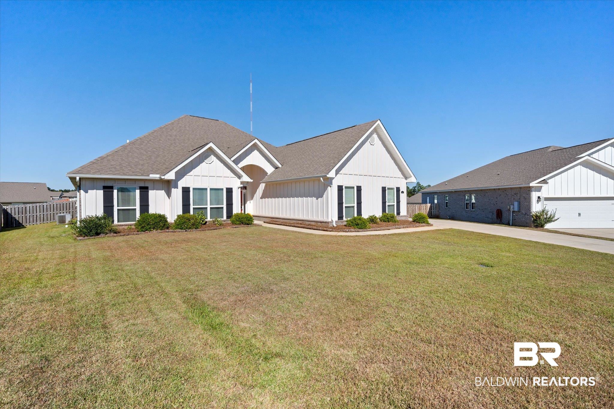 12899 Sanderling Loop Daphne, AL 36527 - Photo 4 of 28 View of front of home featuring a front lawn and a garage