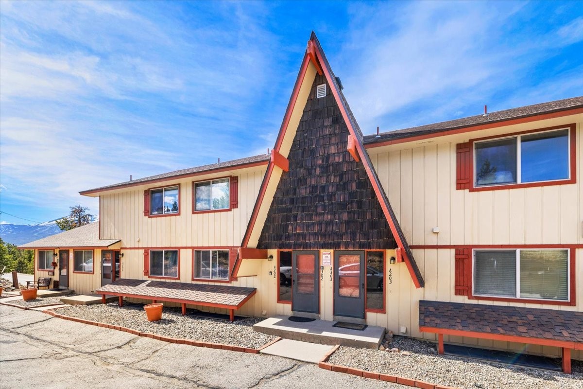 110 Evergreen Road, Unit 301 Dillon, CO 80435 - Photo 2 of 23 a front view of a house with a yard