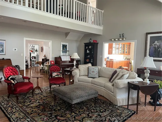 a living room with furniture a couch and dresser