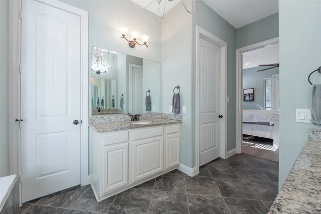 a bathroom with a double vanity sink and mirror