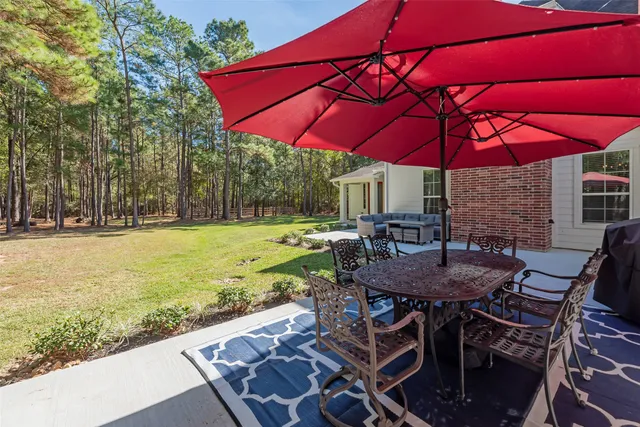 an outdoor space with furniture and umbrella