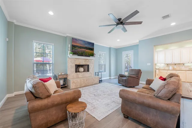 a living room with furniture and a fireplace