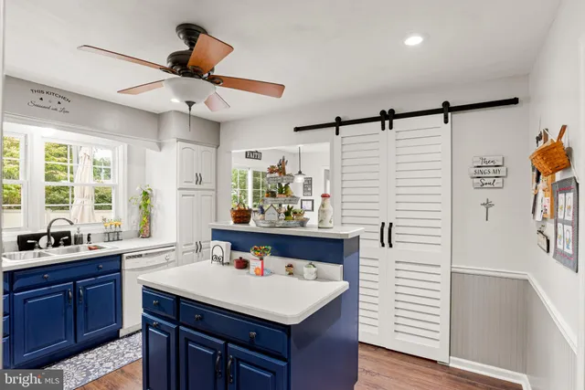 a kitchen with a stove a sink and a refrigerator