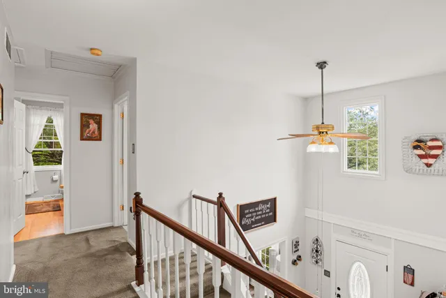 a view of a hallway with windows