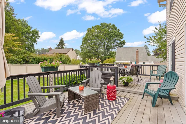 a view of a chairs on wooden deck