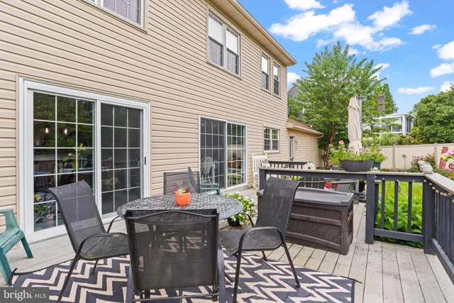 a view of a patio with couple of chairs