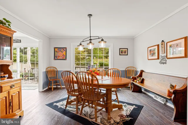 a view of a livingroom with furniture window and wooden floor
