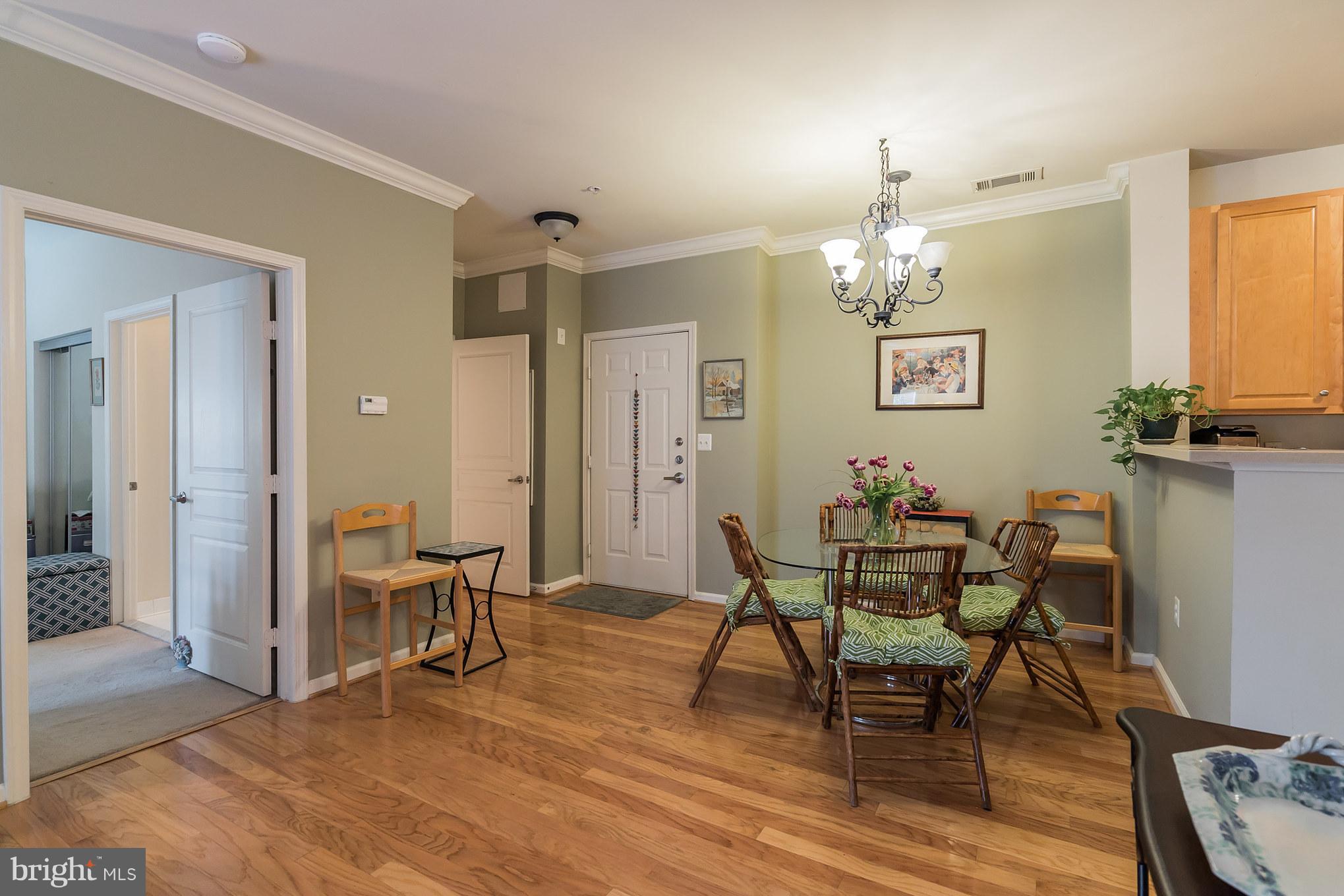 12001 Market Street, Unit 152 Reston, VA 20190 - Photo 7 of 30 Dining Area w/Bedroom Entrance to the Left