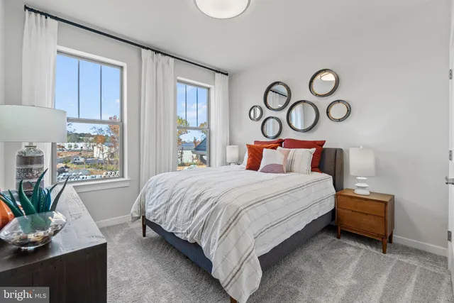 a bedroom with bed and a window