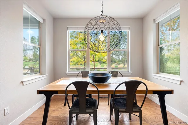a view of a dining room with furniture window and outside view