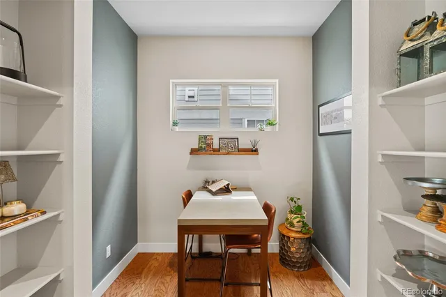 a view of a dining room with furniture and a rug