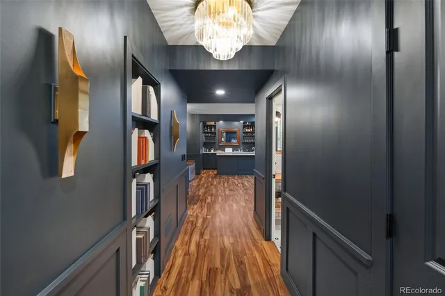 a view of entryway and hall with wooden floor