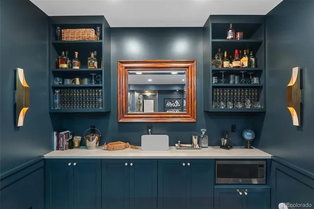 a kitchen with a sink cabinets and a window