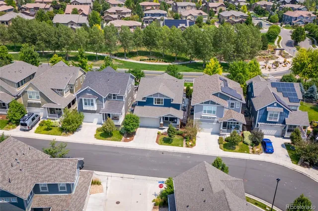 an aerial view of house with yard swimming pool and outdoor seating