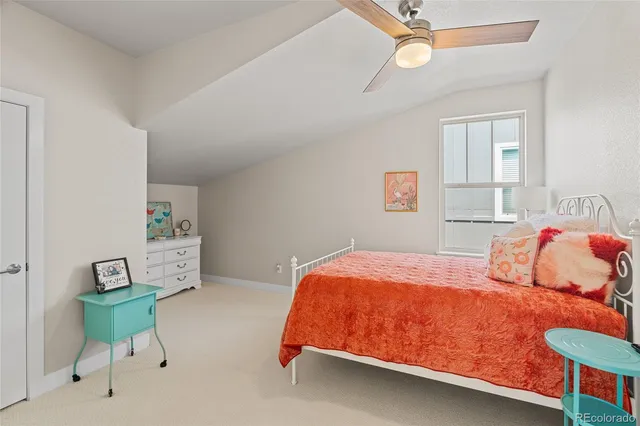 a bedroom with a bed and a chair