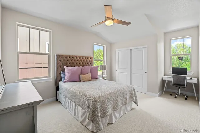 a bedroom with a bed and a table