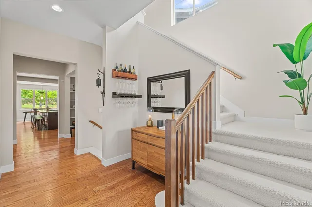 a view of entryway and hall with wooden floor