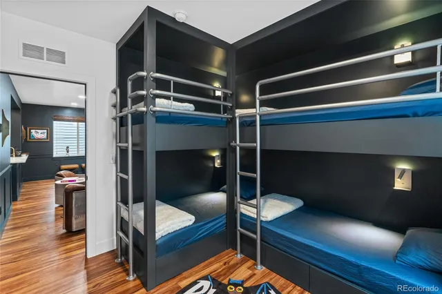 a bedroom with a bunk bed and a potted plant