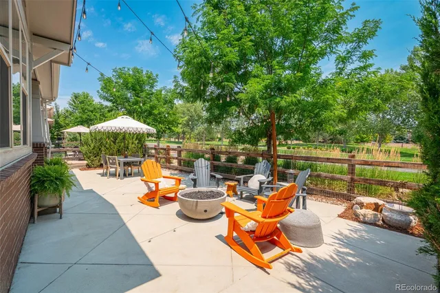 an outdoor space with patio furniture and potted plants