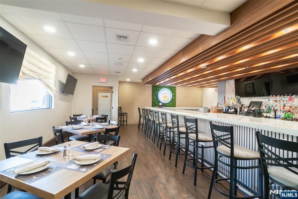 72-74 Elm Road Newark, NJ 07105 - Photo 13 of 41 a dining room with furniture window and wooden floor