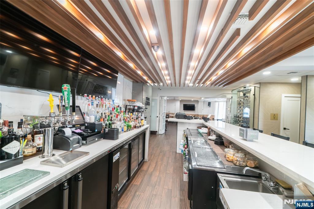 72-74 Elm Road Newark, NJ 07105 - Photo 15 of 41 a view of a kitchen with kitchen island granite countertop lots of counter top space